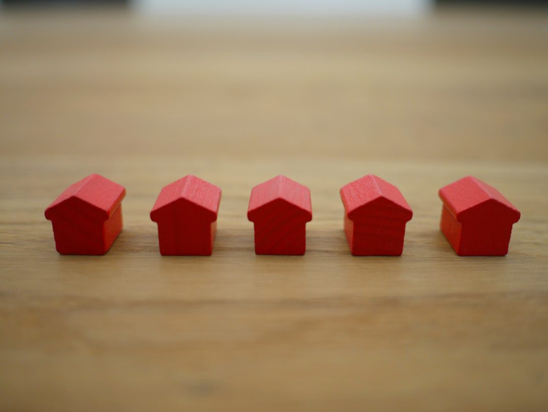 Model houses on a table representing new construction rental homes in Kuna, Idaho managed by AIM