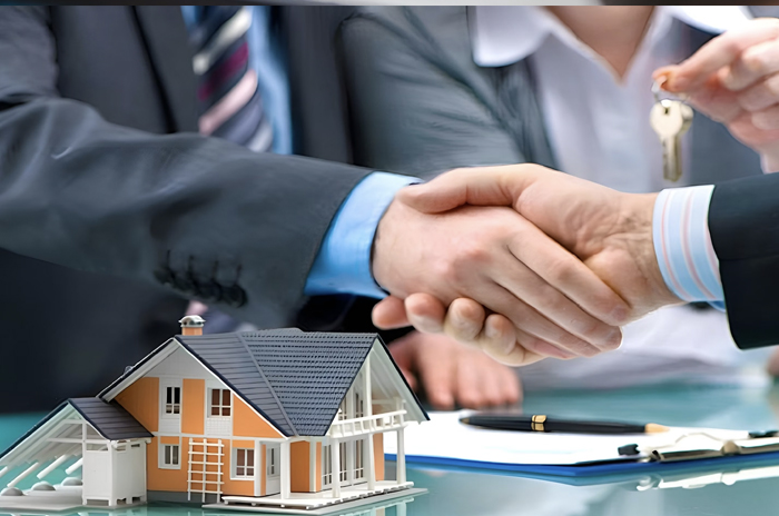 Homeowners shaking hands with a property manager outside their rental